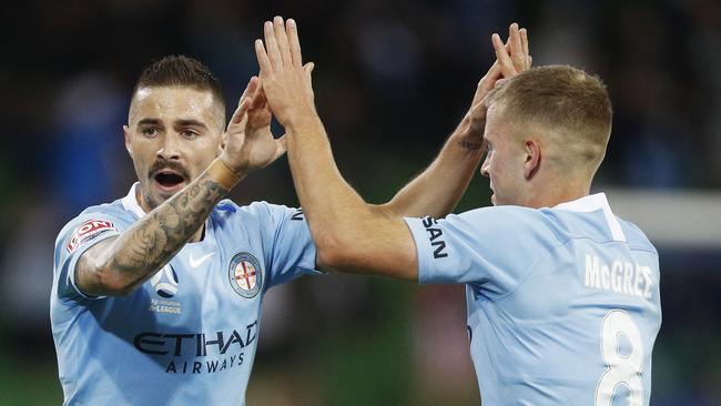 Jamie Maclaren of Melbourne City (left) celebrates after scoring a goal.