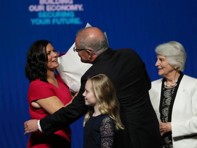 Scott Morrison with his wife Jenny, daughter Abigail and  mother Marion on stage. 