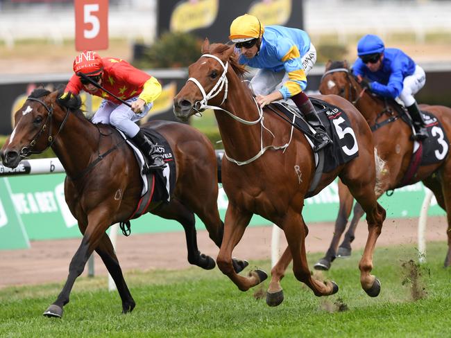 Performer ridden by Hugh Bowman (centre) takes the lead in the closing stages to win the Arrowfield Breeders Plate race during the TAB Epsom Day at Randwick Racecourse in Sydney, Saturday, September 30, 2017. (AAP Image/David Moir) NO ARCHIVING, EDITORIAL USE ONLY