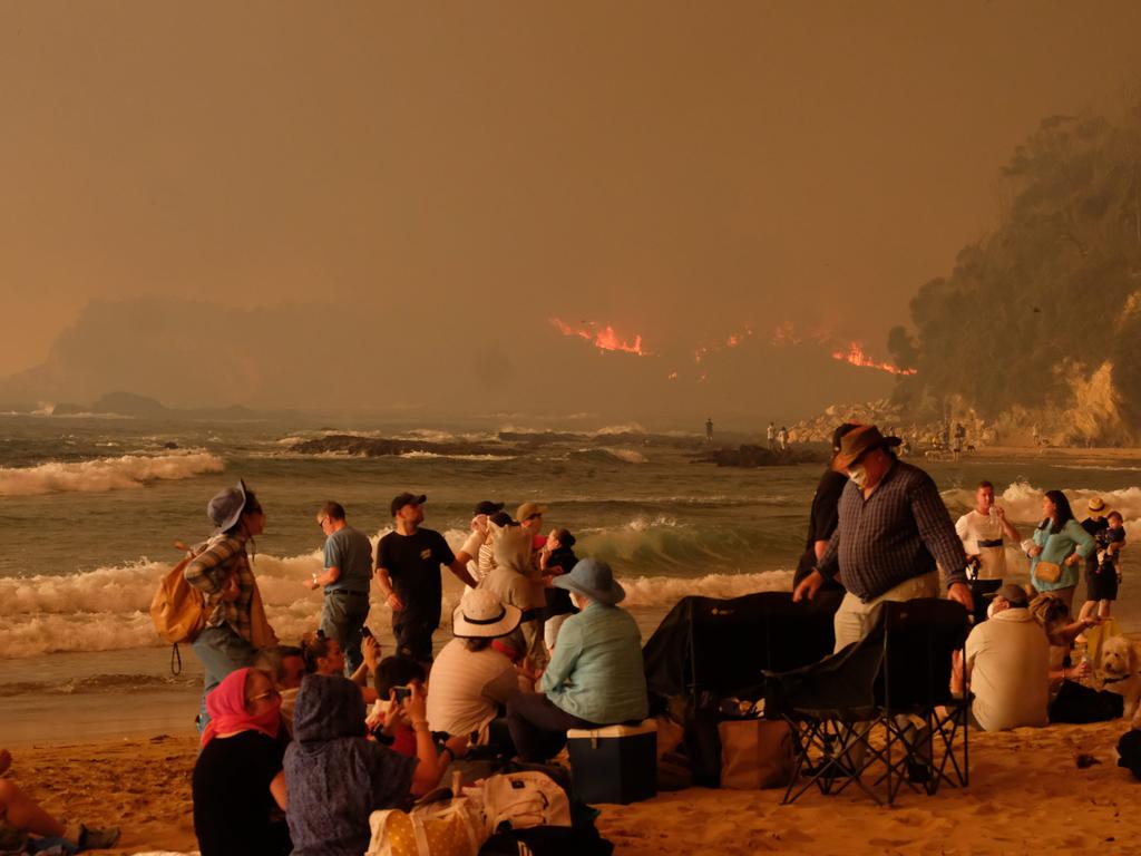 Bushfires arrive at the township of Malua Bay NSW, just south of Batemans Bay. Picture: Alex Coppel.