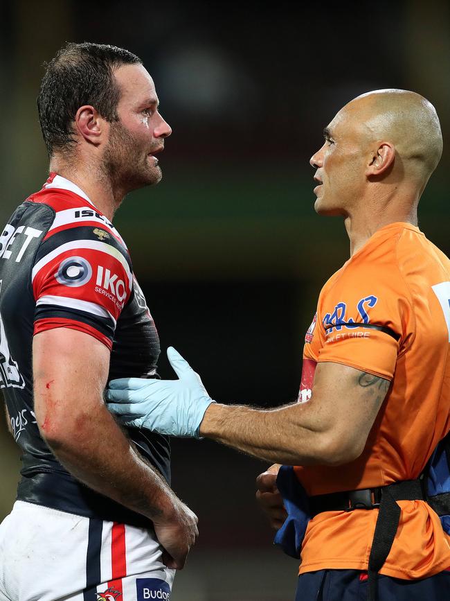 A trainer assesses to Boyd Cordner. Picture: Phil Hillyard