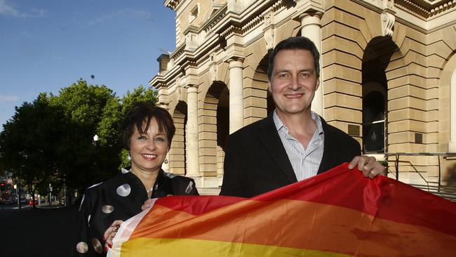 Marriage Equality advocate Rodney Croome with then Lord Mayor Sue Hickey with rainbow flag at Town Hall. Picture: KIM EISZELE