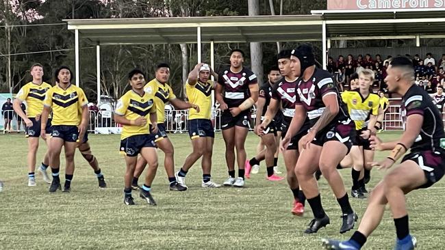 The world's biggest halfback, Taelon Te-Whiu Hopa, headgear, prepares for impact.