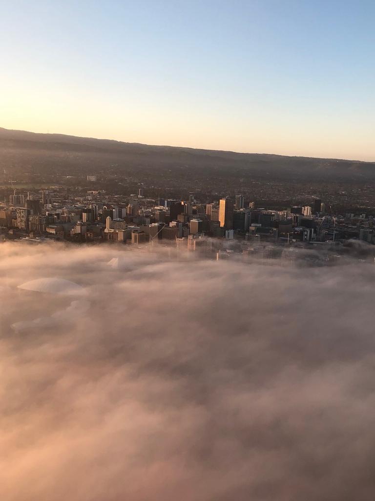 Low cloud and fog over Adelaide, seen from a Melbourne-Adelaide Qantas flight. The flight was diverted back to Melbourne. Picture: Darren Watson