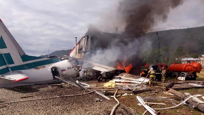 Firefighters work on a burning aircraft at an airport in Russia. Picture: AFP