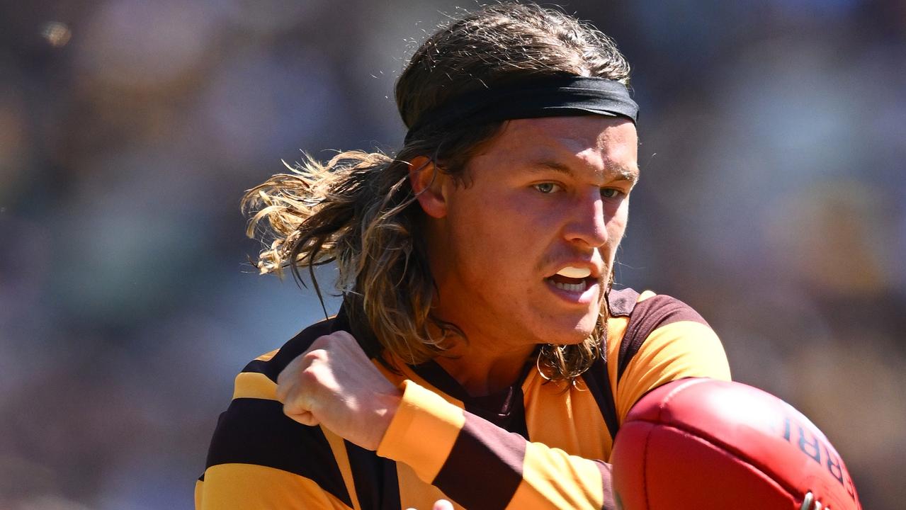 Jack Ginnivan of the Hawks handballs during the round one AFL match between Essendon Bombers and Hawthorn Hawks at Melbourne Cricket Ground, on March 16, 2024, in Melbourne, Australia. (Photo by Quinn Rooney/Getty Images)