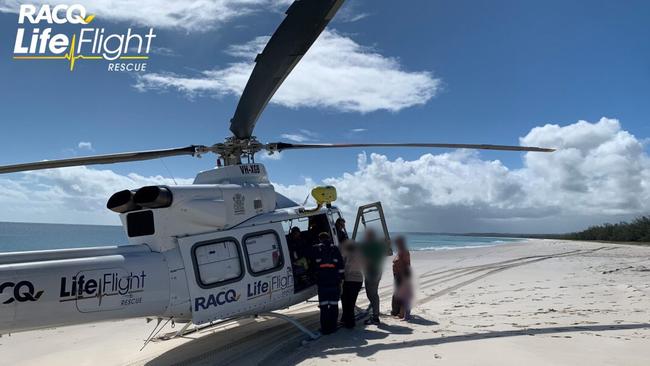 A woman in her 40s was airlifted from the Fraser Coast island of K'gari after breaking her arm while swimming. Image credit: RACQ LifeFlight.