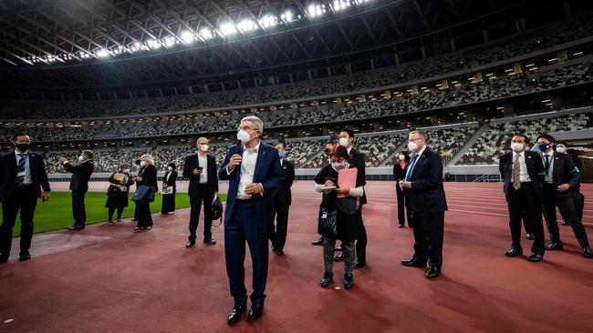 IOC president Thomas Bach tours the Olympic stadium in Tokyo