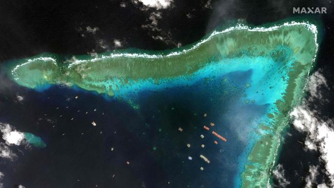 This satellite image taken on March 23, 2021 and received on March 25 from Maxar Technologies shows Chinese vessels anchored at the Whitsun Reef. Picture: Maxar/AFP