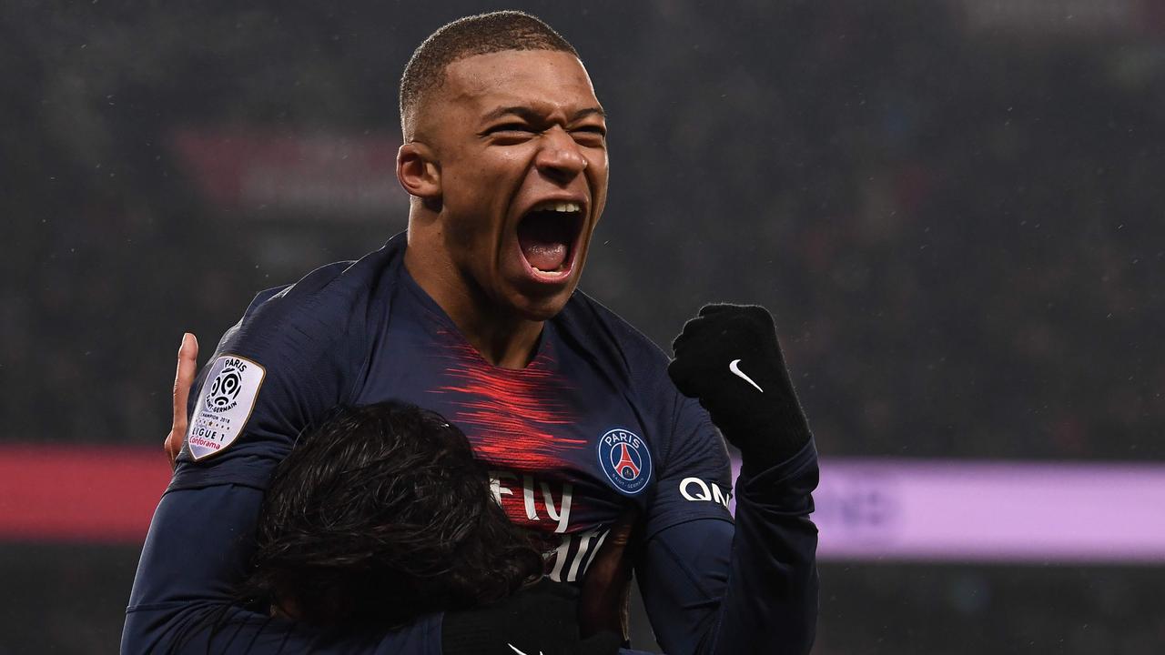 Kylian Mbappe celebrates. (Photo by Anne-Christine POUJOULAT / AFP)