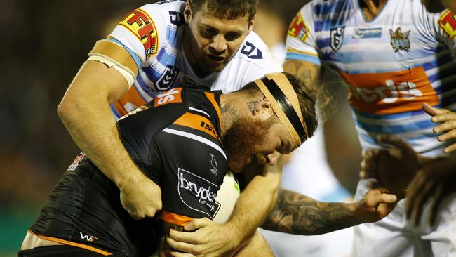 Chris McQueen of the Tigers is tackled during the Round 7 NRL match between the Wests Tigers and the Gold Coast Titans at Scully Park in Tamworth, Saturday, April 27, 2019. (AAP Image/Darren Pateman) NO ARCHIVING, EDITORIAL USE ONLY