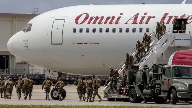 Marines disembarking from a flight in Okinawa, Japan, where they will undergo 14 days of quarantine before making they make their way to Darwin. Picture: MRF-D, Twitter.