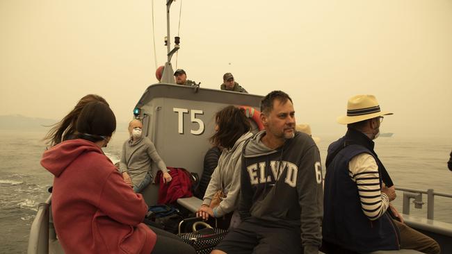 Evacuees from Mallacoota are transported by landing craft to MV Sycamore. Picture: ADF