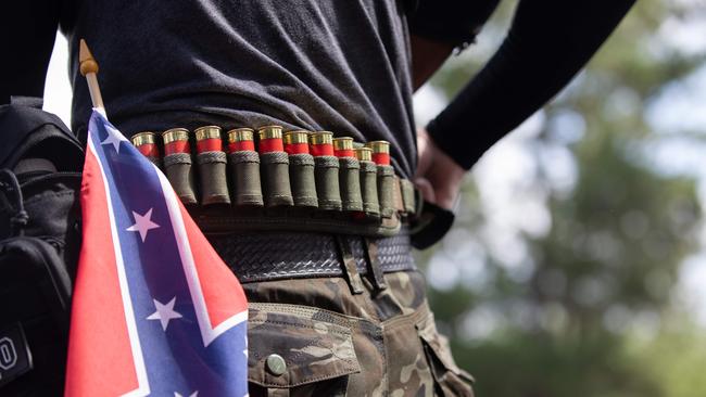 A man with ammunition and a confederate flag, takes part in far right militias and white pride organisations rally in Georgia in 2020. Picture: Logan Cyrus/AFP