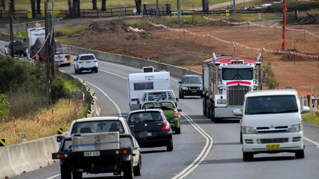 Re-routed traffic makes its way around the Northern Road upgrade in Sydney today.