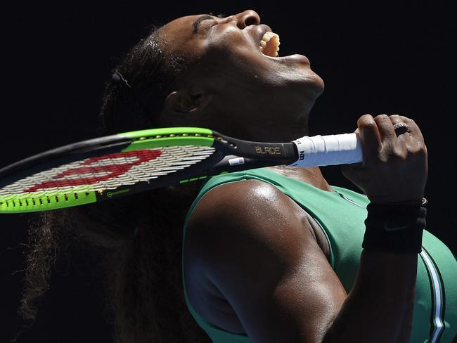 United States' Serena Williams reacts after losing a point to Karolina Pliskova of the Czech Republic during their quarterfinal match at the Australian Open tennis championships in Melbourne, Australia, Wednesday, Jan. 23, 2019. (AP Photo/Andy Brownbill)