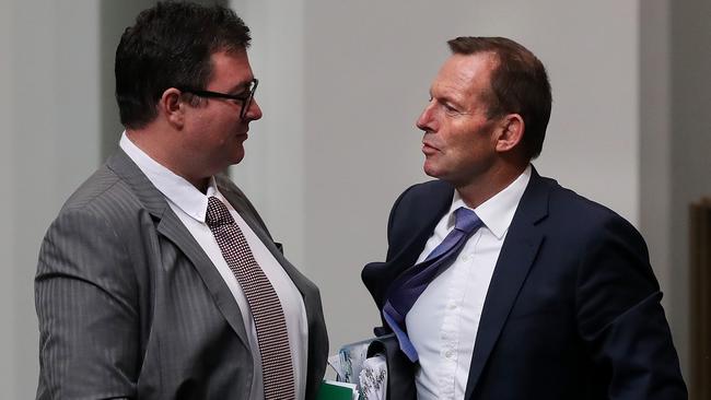 George Christensen and Tony Abbott talk after Question Time in Canberra yesterday. Picture Kym Smith