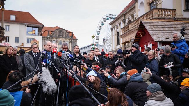 German Chancellor Olaf Scholz, centre, speaks to the press during a visit to the site of the car-ramming attack in Magdeburg, eastern Germany. Picture: AFP