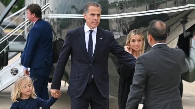 Hunter Biden with his son Beau and his wife Melissa Cohen Biden at Delaware Air National Guard Base. Picture: AFP.