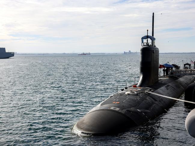 ROCKINGHAM, AUSTRALIA - FEBRUARY 26: U.S. Navy officers stand guard aboard Virginia-class fast attack submarine USS Minnesota (SSN-783) after the vessel docked at HMAS Stirling on February 26, 2025 in Rockingham, Australia. The submarine was on a port visit. (Photo by Colin Murty - Pool/Getty Images)