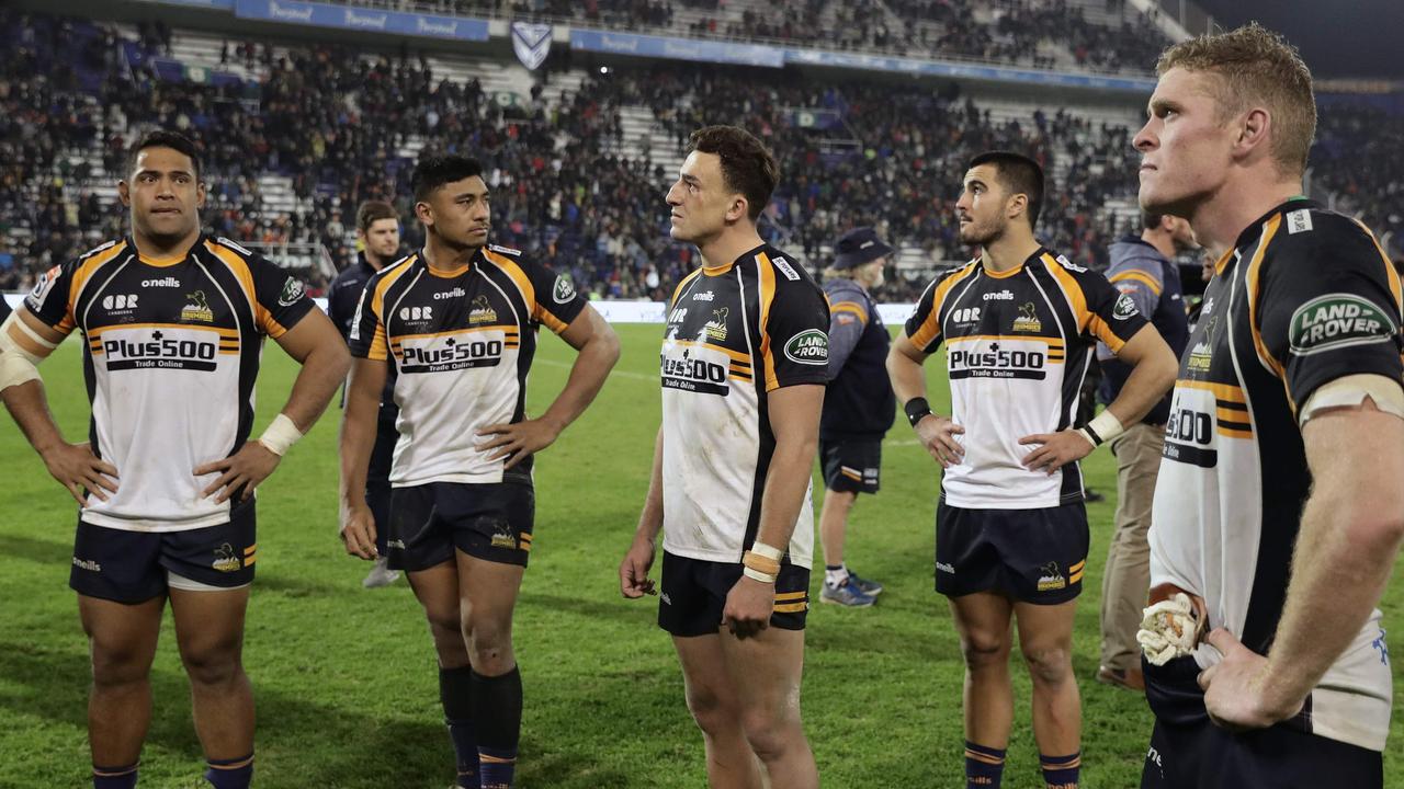 Brumbies players react in dejection after losing in a Super Rugby semifinal.