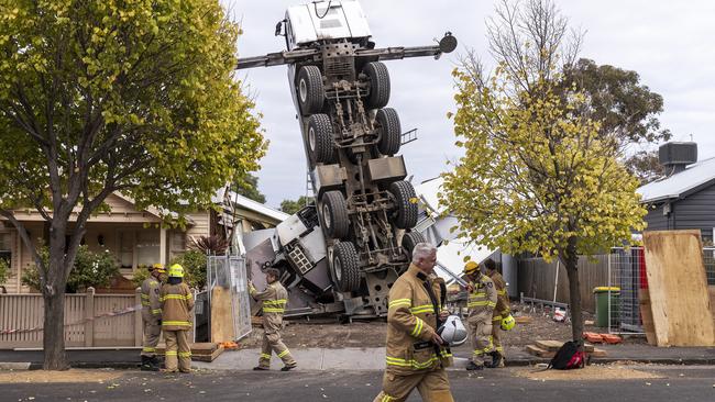 A crane is seen after it collapsed on two houses in Yarraville, Melbourne, Wednesday, April 10, 2019. (AAP Image/Daniel Pockett) NO ARCHIVING