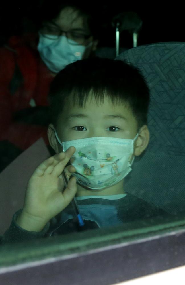 A young boy, one of the latest people to be evacuated from Wuhan to a quarantine zone on Christmas Island amid the coronavirus crisis. Picture: Nathan Edwards