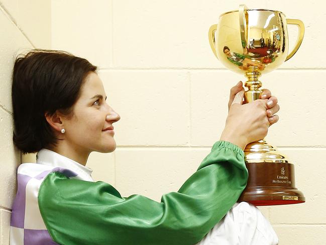 2015 Melbourne Cup day at Flemington Racecourse, Race7- Melbourne Cup, Michelle Payne spends a quiet moment in the jockeys room with the Melbourne Cup after her win on Prince Of Penzance. Melbourne. 3rd November 2015. Picture: Colleen Petch. MelbourneCup15