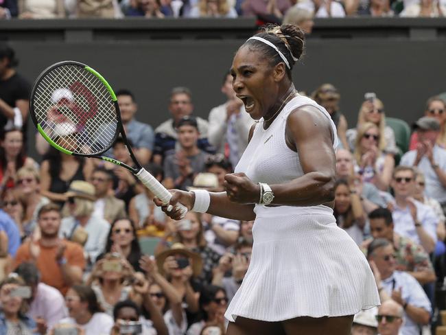 United States' Serena Williams celebrates defeating United States' Alison Riske during a women's quarterfinal match on day eight of the Wimbledon Tennis Championships in London, Tuesday, July 9, 2019. (AP Photo/Kirsty Wigglesworth)