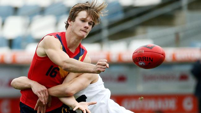 Jonty Scharenberg gets a handball away for South Australia against Vic Country. Picture: Colleen Petch.