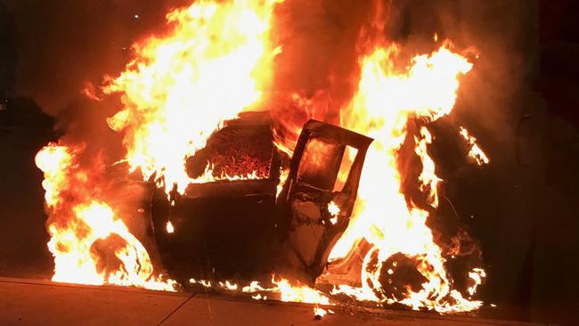 A Suzuki Swift which was set on fire, but was not the actual car used in the Love Machine drive-by shooting.