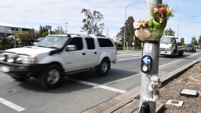 The family of 12-year-old Dawlon Smith-Saunders has left flowers and other items by the roadside on David Low Way in Bli Bli. Picture: Patrick Woods.