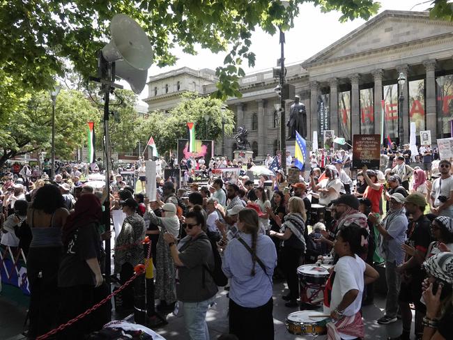 Protesters gather at the State Library on Sunday. Picture: Valeriu Campan