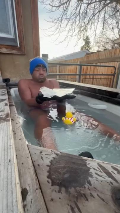 Cold-plunge enthusiast stays put as outdoor tub freezes over