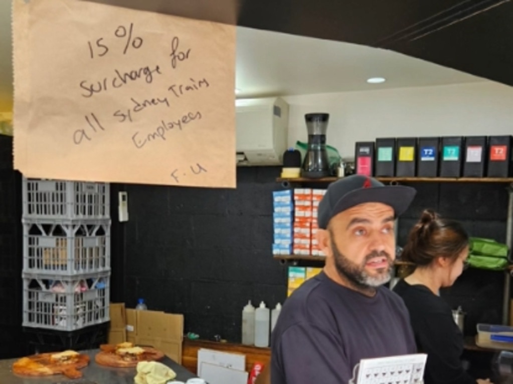 Hatch Espresso owner Sam Saleh with the 15 per cent surcharge sign. <span>Picture: Supplied</span>