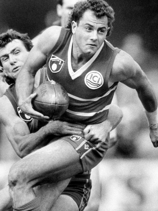 Tony McGuinness attempts to handball during a WFL match between Footscray and Brisbane Bears in 1990. Picture: News Corp