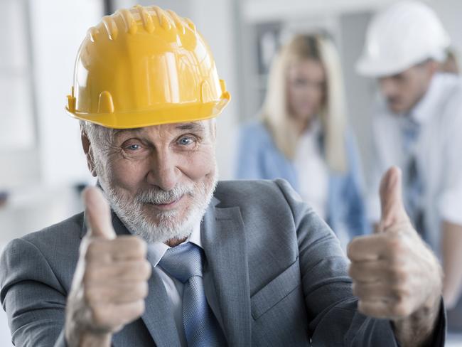 Senior business man looking at the camera, showing thumbs up. senior workers generic, older employees