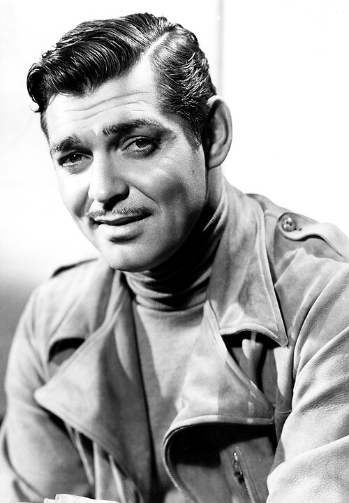 “The King of Hollywood” Clark Gable wearing an overcoat with a turtleneck sweater.