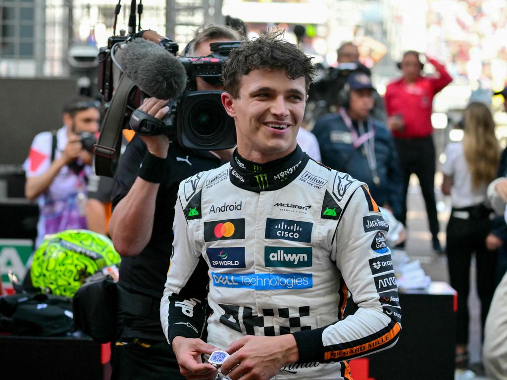 McLaren's British driver Lando Norris (C) reacts after winning the Formula 1 Monaco GP. Picture: AFP