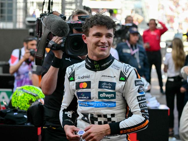 McLaren's British driver Lando Norris (C) reacts after winning the Formula 1 Monaco GP. Picture: AFP