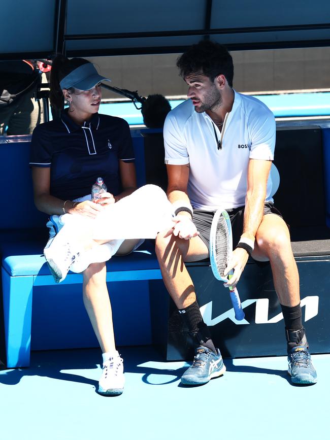 Ajla Tomljanovic of Australia sits with Matteo Berrettini of Italy during a practice session ahead of the 2022 Australian Open. (Photo by Clive Brunskill/Getty Images)