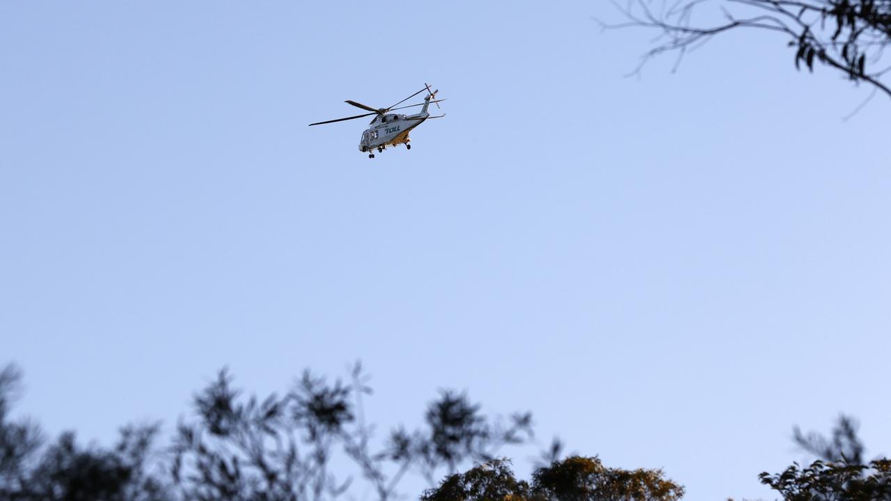NSW Ambulance helicopters worked to retrieve critically injured family members caught in a landslide. Picture: Jonathan Ng