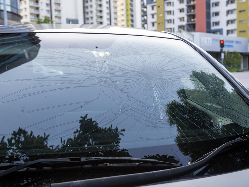 Nearby the targeted businesses, a parked car was found with its front windscreen smashed in on Knuckey St on Tuesday morning. Picture: Floss Adams.