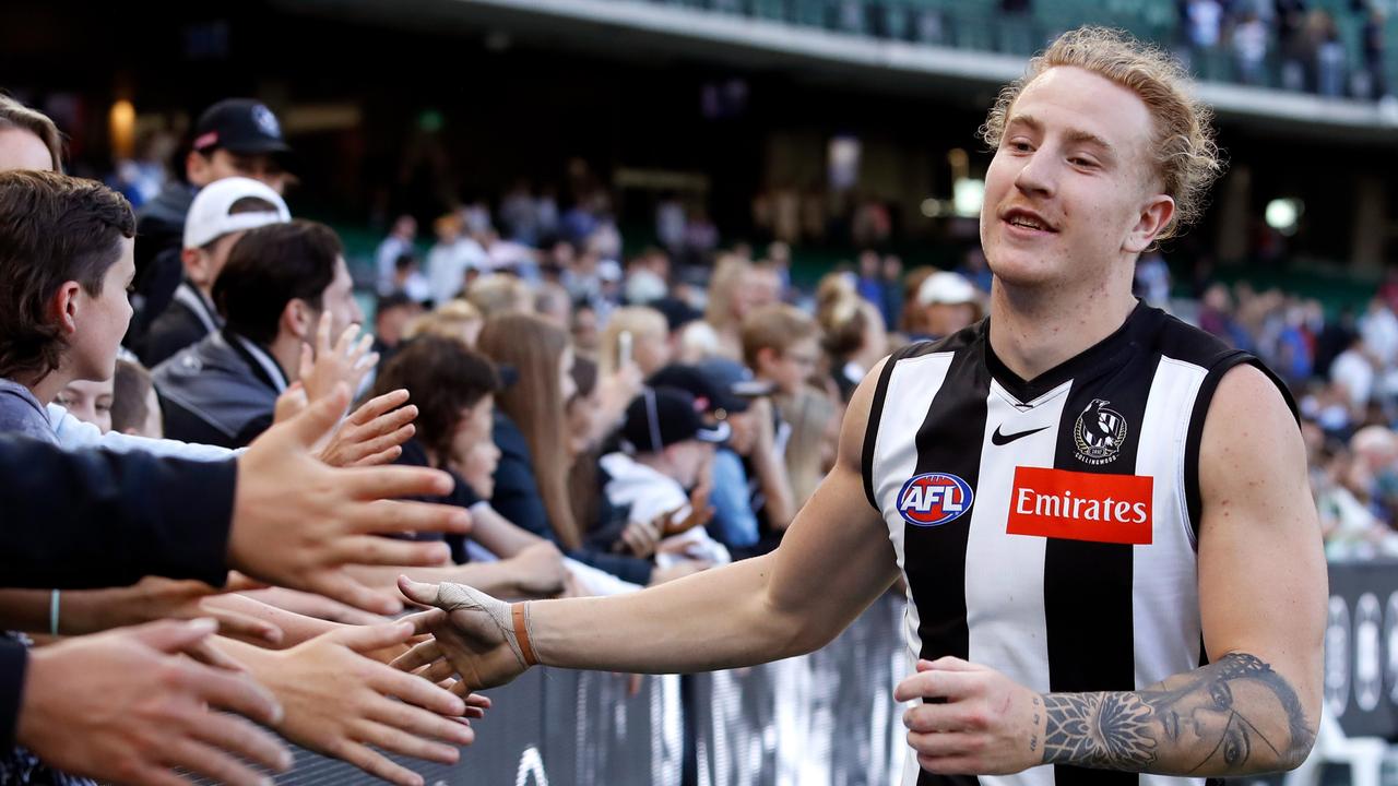 Beau McCreery of the Magpies celebrates with fans. Photo by Dylan Burns/AFL Photos via Getty Images.