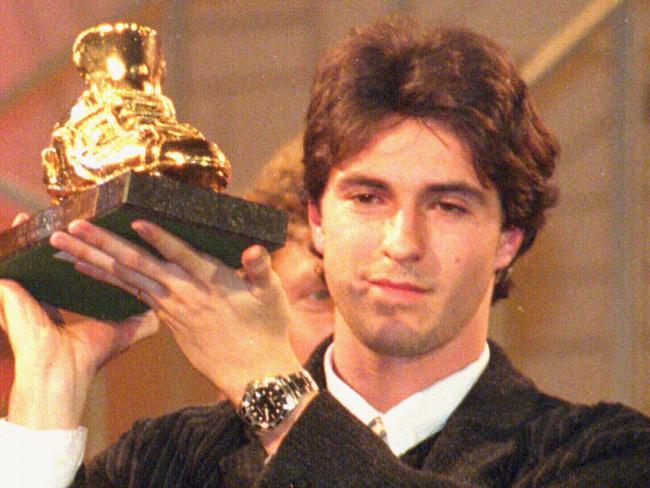 Former Club Brugge star Paul Okon with the Golden Boot award.