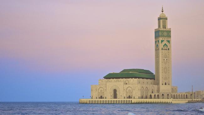 Sunset image of the King Hassan II Mosque on the Atlantic Coast of Casablanca in Morocco.