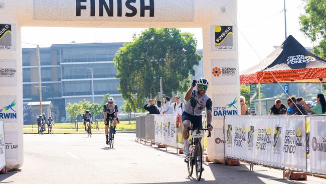 Ryan Coppola celebrating at the finish line of the 145km Sunbuild Top End Gran Fondo 2023, Darwin. Picture: Pema Tamang Pakhrin