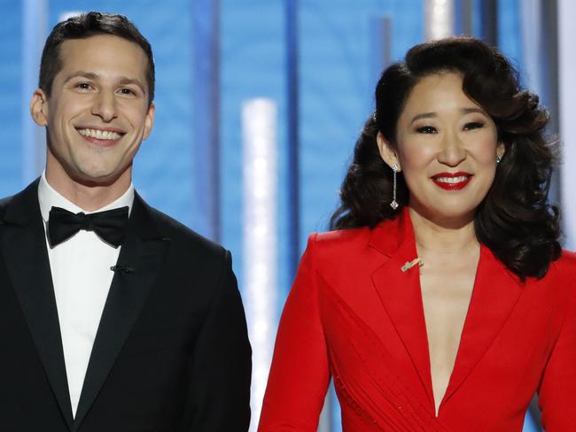 This image released by NBC shows hosts Andy Samberg, left, and Sandra Oh at the 76th Annual Golden Globe Awards at the Beverly Hilton Hotel on Sunday, Jan. 6, 2019, in Beverly Hills, Calif. (Paul Drinkwater/NBC via AP)