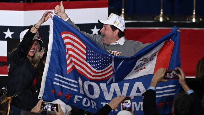 Supporters of former US President and Republican presidential hopeful Donald Trump celebrate during the 2024 Iowa Republican presidential caucuses in Des Moines, Iowa. Picture: Jim Watson