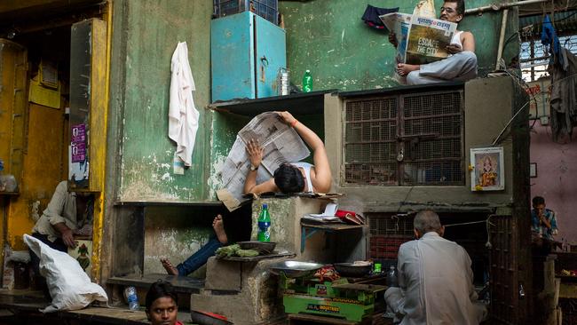 Escher's Market Picture: Karl Grenet, Winner, Australia, National Award, 2015 Sony World Photography Awards Year: 2015 I came across this scene one afternoon in November 2014 while exploring the maze-like Mirza Ghalib Municipal Market in the Null Bazar area of Mumbai, India. As this is a 24-hour market, the shopkeepers take any possible opportunity between sales to rest for a few minutes. I chatted with the shopkeepers at this stall for 20 minutes, all the while making images of the scene, with no two images being the same due to the constant movement of shopkeepers going to their own stalls to make a sale, then returning to this stall to rest.